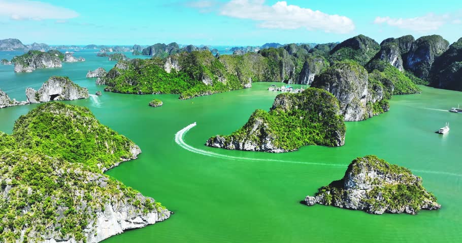 Aerial view of Scenic Halong Bay, Vietnam with boats amongst limestone islands. UNESCO World Heritage Site. Popular landmark, famous destination of Vietnam
