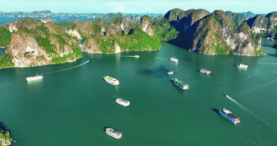Aerial view of Scenic Halong Bay, Vietnam with boats amongst limestone islands. UNESCO World Heritage Site. Popular landmark, famous destination of Vietnam