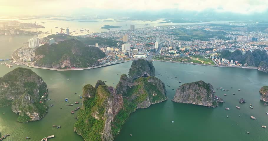 Aerial view of Ha Long city and rock island, Halong Bay, Vietnam, Southeast Asia. UNESCO World Heritage Site. Junk boat cruise to Ha Long Bay. Popular landmark, famous destination of Vietnam