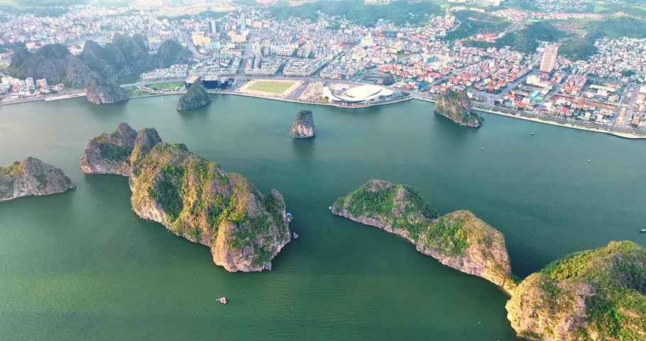 Aerial view of Ha Long city and rock island, Halong Bay, Vietnam, Southeast Asia. UNESCO World Heritage Site. Junk boat cruise to Ha Long Bay. Popular landmark, famous destination of Vietnam