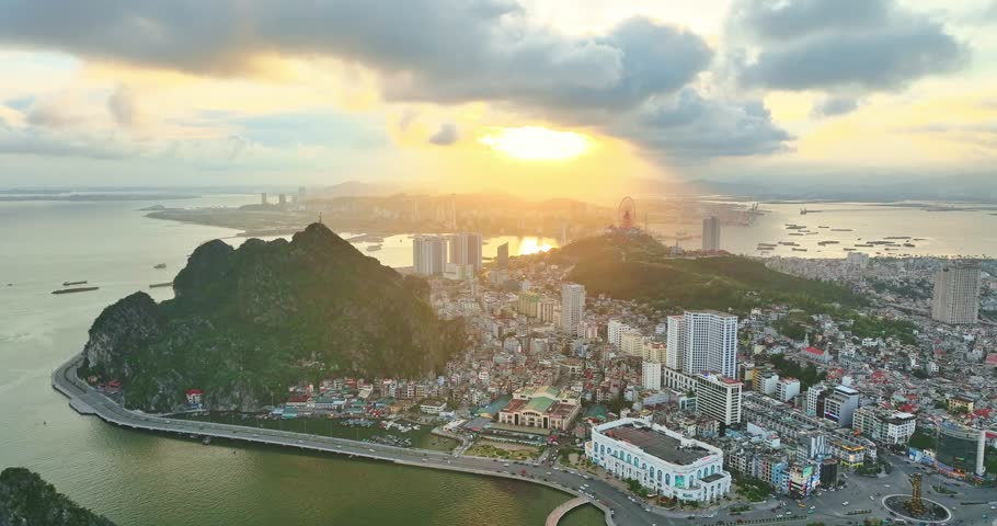 Aerial view of Ha Long city and rock island, Halong Bay, Vietnam, Southeast Asia. UNESCO World Heritage Site. Junk boat cruise to Ha Long Bay. Popular landmark, famous destination of Vietnam