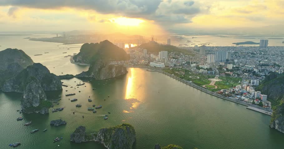 Aerial view of Ha Long city and rock island, Halong Bay, Vietnam, Southeast Asia. UNESCO World Heritage Site. Junk boat cruise to Ha Long Bay. Popular landmark, famous destination of Vietnam