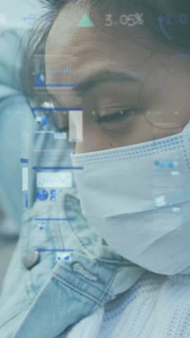 Animation of financial data processing over woman in face mask in street. Global covid 19 pandemic, business, computing and data processing concept digitally generated video.