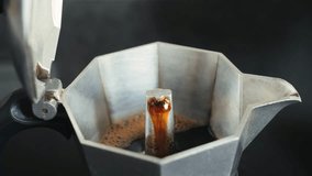 Geyser coffee maker close up. Making Italian espresso with a moka pot. . High quality 4k footage - Powered by Shutterstock - Get 15% off with code: PIKWIZARD15