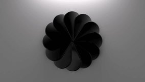 Minimal black glossy flower of drop shaped petals rotating slowly on a gray backdrop seamless looping 3d abstract motion graphic. 3d loop animation 4k - Powered by Shutterstock - Get 15% off with code: PIKWIZARD15