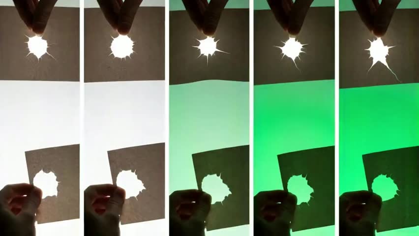 Hands tear rough paper to reveal a green screen hole in this dynamic video transition. Perfect for revealing logos, text, or a new scene!