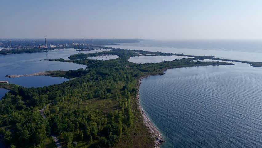 Aerial view of Toronto Tommy Thompson Park Islands and Lake Ontario skyline in clear summer light. g.