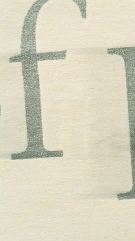 Vintage Newspaper Typography Flux. Rapid composite shifts in bold serif characters and fragmented snippets across weathered beige paper stock.