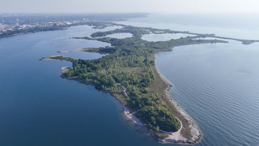 Aerial view of Toronto Tommy Thompson Park Islands and Lake Ontario skyline in clear summer light. g.