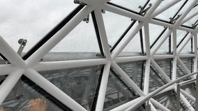 Futuristic interior structure of the Lithuanian Museum of Ethnocosmology, featuring geometric metal framing and glass panels in a domed observatory design. - Powered by Shutterstock - Get 15% off with code: PIKWIZARD15