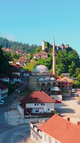 Vertical 4K Aerial View of Maglaj Fortress and Kuršumlija Mosque, Bosnia