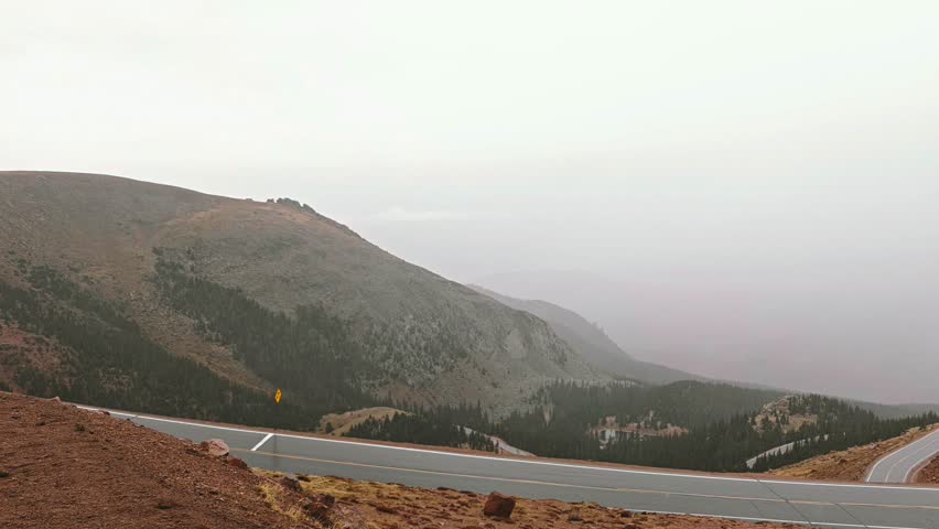 Pikes Peak Colorado in the fall against a beautiful cloudy sky Ute pass overlook