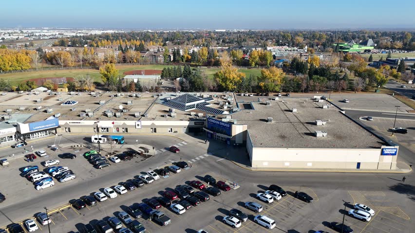 Aerial video of Lawson Heights Saskatoon in fall, showing colorful trees, parks, and homes along the river in crisp 4K.