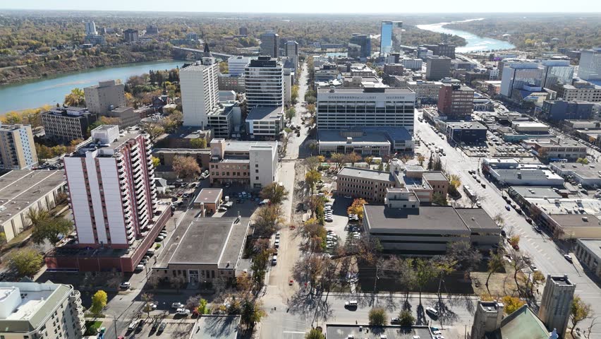 Aerial video of Downtown Saskatoon in fall showing colorful trees, river views, and skyline landmarks in crisp 4K.