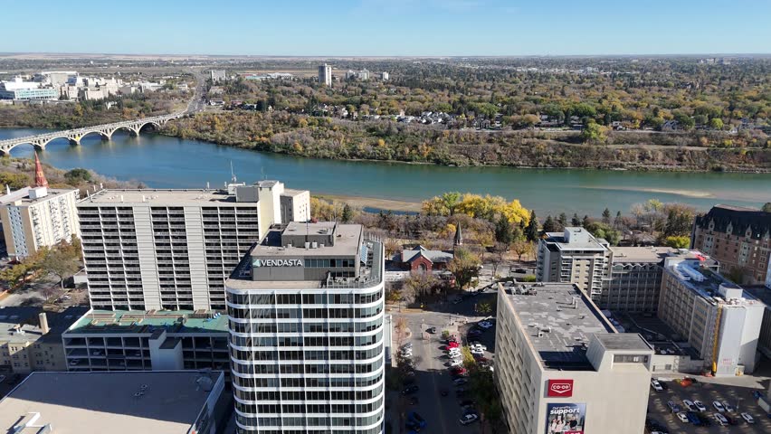 Autumn aerial video of Saskatoon’s Central Business District highlighting golden trees and city architecture in 4K.