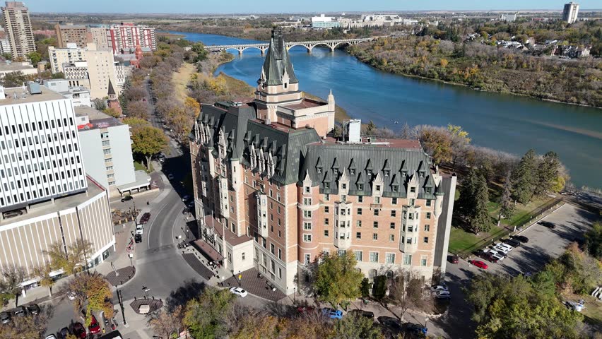 Aerial video of Downtown Saskatoon in fall showing colorful trees, river views, and skyline landmarks in crisp 4K.