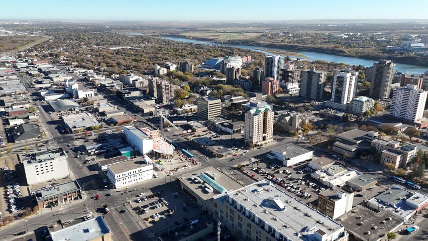 Aerial video of Downtown Saskatoon in fall showing colorful trees, river views, and skyline landmarks in crisp 4K.