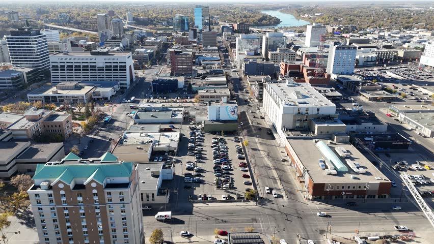 Aerial video of Downtown Saskatoon in fall showing colorful trees, river views, and skyline landmarks in crisp 4K.