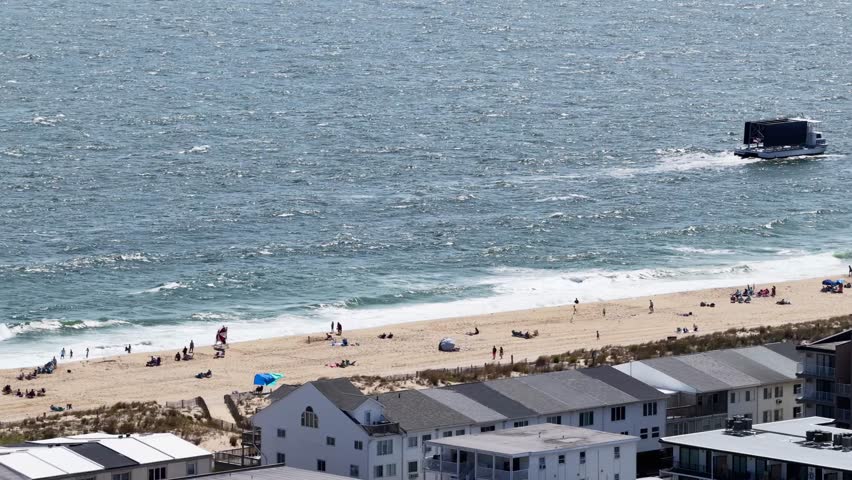 People relaxing on the beach in Ocean City Maryland USA