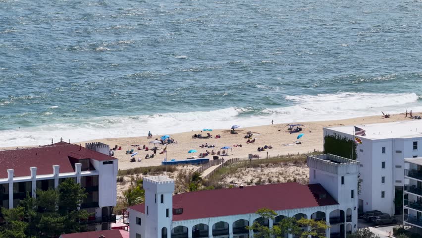 People relaxing on the beach in Ocean City Maryland USA
