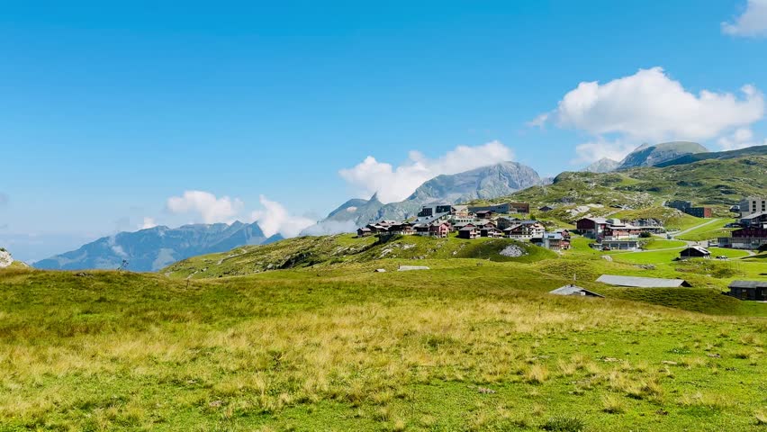 Hike from Melchsee-Frutt to the summit of the Hochstollen. Beautiful mountain landscape with refreshing mountain lakes and lush green grass in the canton of Obwalden, Switzerland.