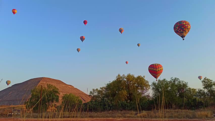 Hot Air Balloons over the road near Pyramids od Teotihuacan