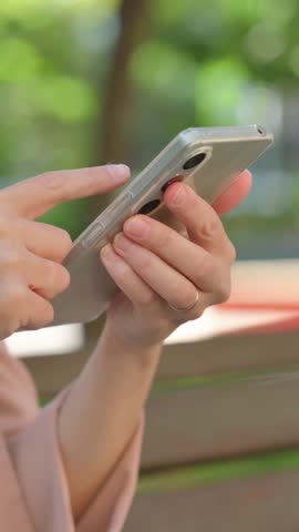 Close up of Casual Business Woman Using Smartphone Outdoor