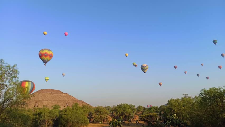 Hot Air Balloons over the road near Pyramids od Teotihuacan