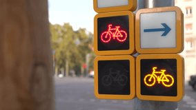 Close-up of bicycle traffic lights changing from red to Yellow in an urban environment in Barcelona, Spain. Sustainable transport and city cycling concept, 4K stock video. - Powered by Shutterstock - Get 15% off with code: PIKWIZARD15