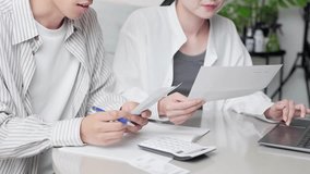 Asian couple checking shopping receipt - Powered by Shutterstock - Get 15% off with code: PIKWIZARD15