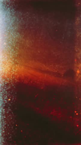 Moody Grunge Fast Motion Vertical Video with Heavy Scratches and Cinematic Light Leak, Dark and Grainy Retro Film Overlay for Thriller Intros or Atmospheric Stories