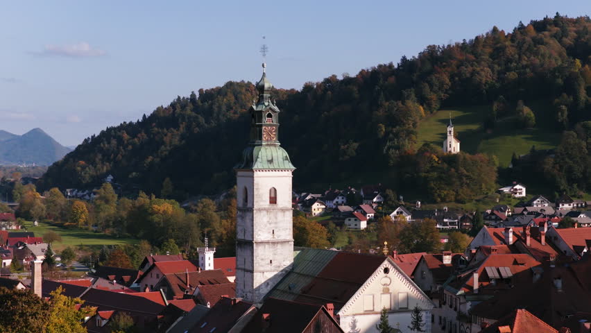 St. Jacob Church Tower In Skofja Loka During The Autumn Season In Slovenia. Aerial Close-up Shot