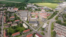 Stable aerial hover near guard tower with gentle yaw for exterior detail; continuous shot, daytime. - Powered by Shutterstock - Get 15% off with code: PIKWIZARD15