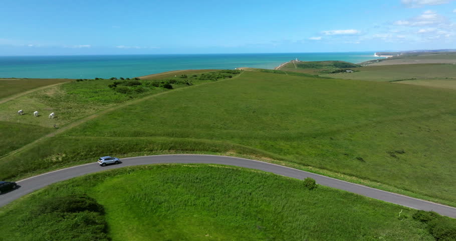 Driving On The Road Along The Seven Sisters Cliffs On The English Channel Coast In East Sussex, England. Aerial Tracking Shot
