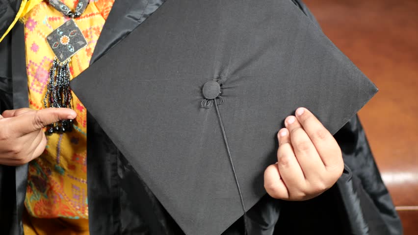 Student hold hats in hand during commencement success 4k