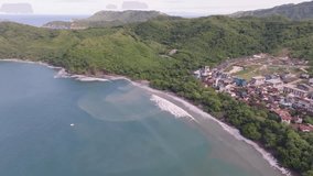 Las Catalinas, Guanacaste Province in Costa Rica showing homes, mountains and ocean with drone video moving in a circle. - Powered by Shutterstock - Get 15% off with code: PIKWIZARD15