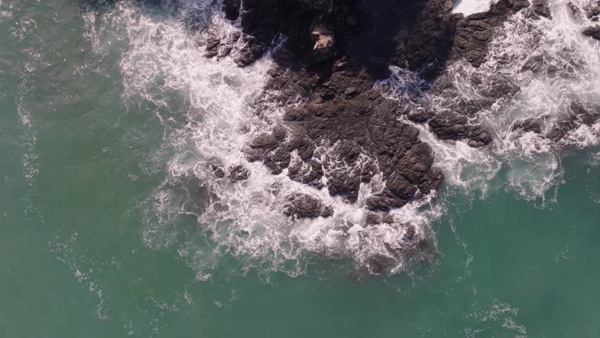 Las Catalinas, Guanacaste Province in Costa Rica showing homes, mountains and ocean with drone video spinning up.