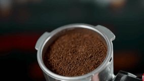 Dark, finely ground coffee fills the portafilter, preparing for espresso brewing. Rich aroma and texture highlight the essence of coffee culture. - Powered by Shutterstock - Get 15% off with code: PIKWIZARD15