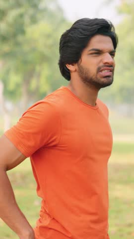 Vertical Video of Young Indian Man Having Back Pain