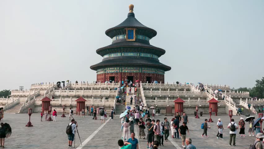 Temple of heaven in beijing china with tourists exploring the historic landmark