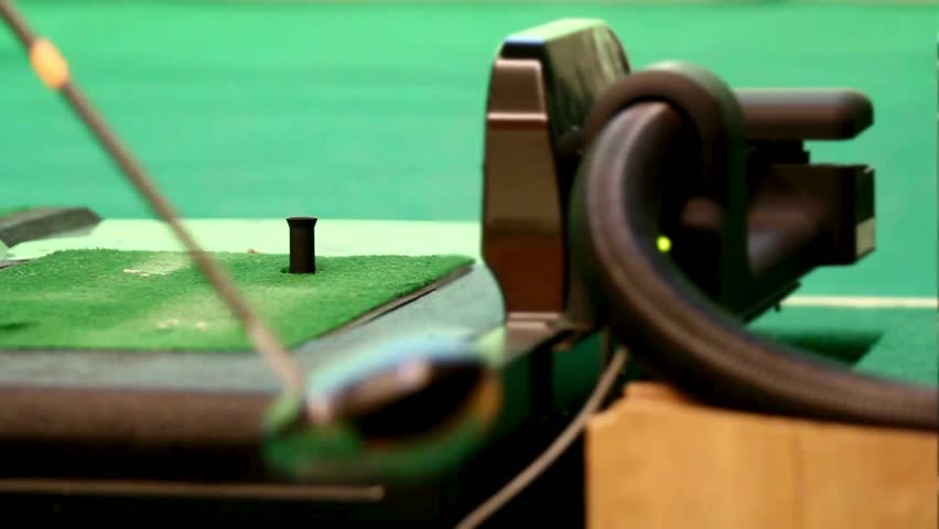 Golf swing training device demonstrates innovative tools for enhancing golfer performance and refining swing techniques on the putting green. - Powered by Shutterstock - Get 15% off with code: PIKWIZARD15