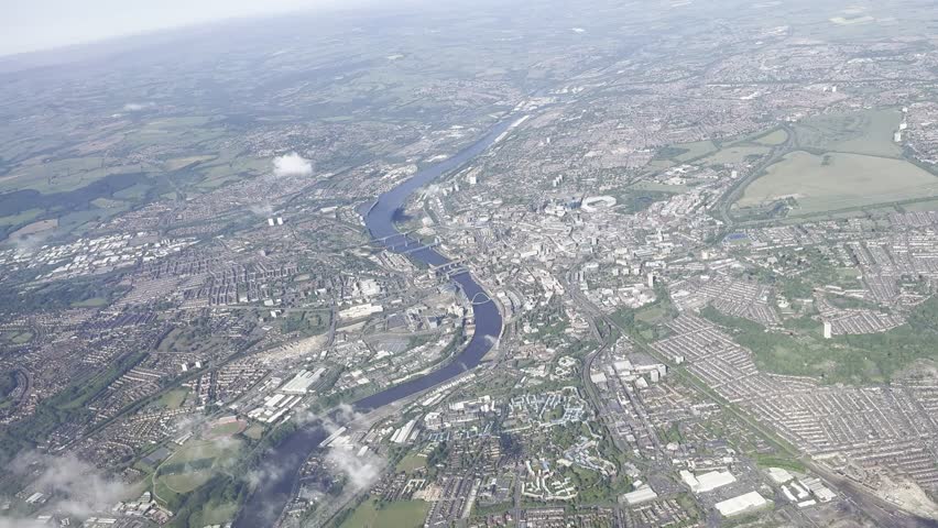 Aerial view via plane over Newcastle Upon Tyne Quayside and City Centre, with River Tyne Bridges and St James