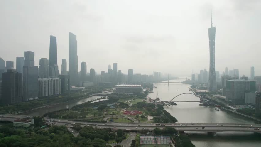 Guangzhou cityscape with Pearl River and modern architecture on a hazy overcast day