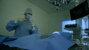 Female veterinary surgeon suturing the wound after dog cancerous tumor removal procedure in an animal hospital operating room, low angle shot. - Powered by Shutterstock - Get 15% off with code: PIKWIZARD15