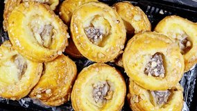 Danish pastries, a sweet, multilayered, flaky pastry made from a laminated, yeast-leavened dough with a high butter content, soaked with sweet honey syrup, filled with cinnamon, raisin and pineapple - Powered by Shutterstock - Get 15% off with code: PIKWIZARD15