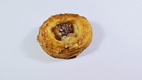 Danish pastries, a sweet, multilayered, flaky pastry made from a laminated, yeast-leavened dough with a high butter content, soaked with sweet honey syrup, filled with cinnamon, raisin and pineapple - Powered by Shutterstock - Get 15% off with code: PIKWIZARD15