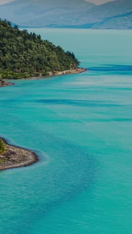 Aerial Drone View of Tropical Queensland Beach, Ocean Waves, Island Coastline and Shoreline - Scenic Coastal Landscape, Clear Blue Water, Australia