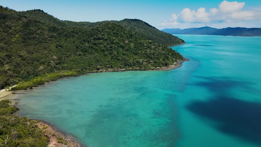 Aerial Drone View of Tropical Queensland Beach, Ocean Waves, Island Coastline and Shoreline - Scenic Coastal Landscape, Clear Blue Water, Australia