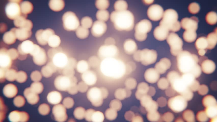 Bokeh lights glittering and glowing on cold winter background. Seamless loop.