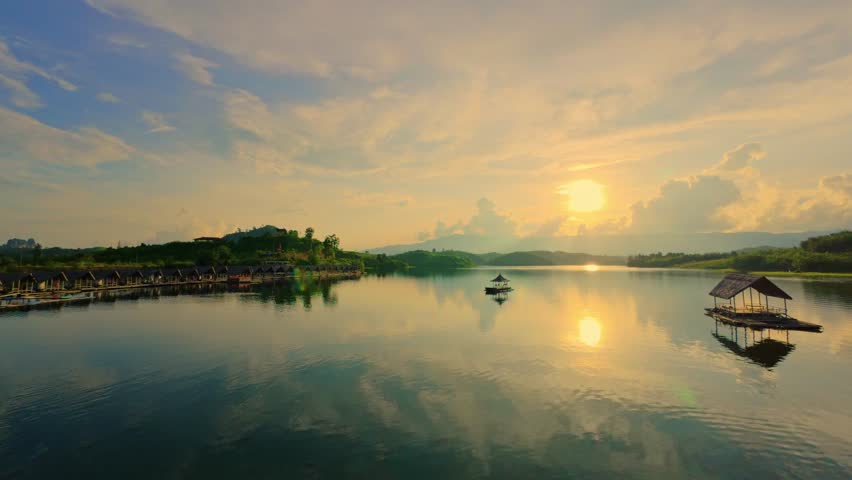 FPV drone video exploring Ang Nam Tong View Resort in Laos  Located on the waterfront the resort offers a beautiful atmosphere with tall mountains and a beautiful sunset